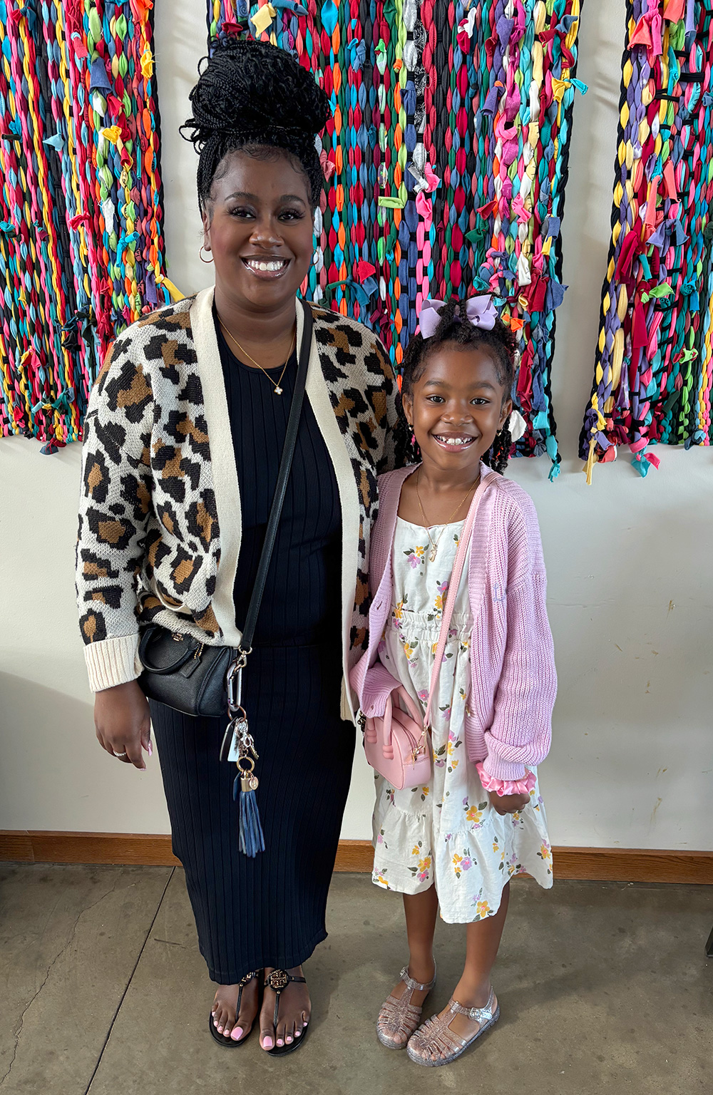 Mom kisses a smiling baby in her arms